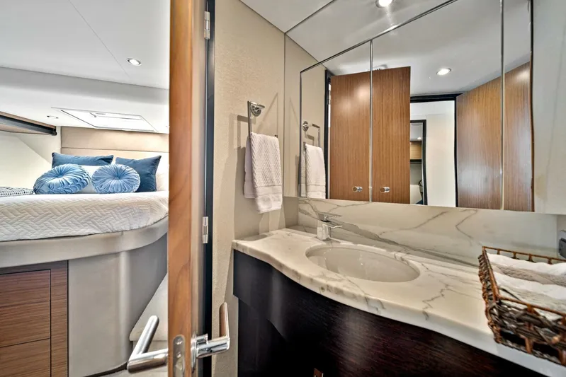 West Yacht Photos Pics Luxurious bathroom and bedroom in a 2017 Hatteras 60 Motor Yacht.