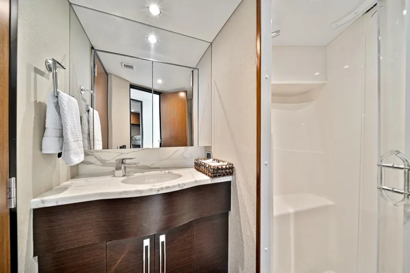 West Yacht Photos Pics Modern bathroom on 2017 Hatteras 60 Motor Yacht with sleek vanity and shower.