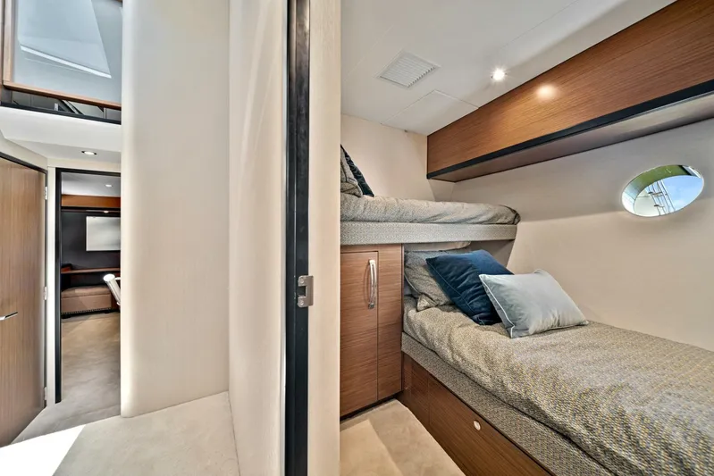 West Yacht Photos Pics Interior cabin of 2017 Hatteras 60 Motor Yacht with bunk beds and modern design.