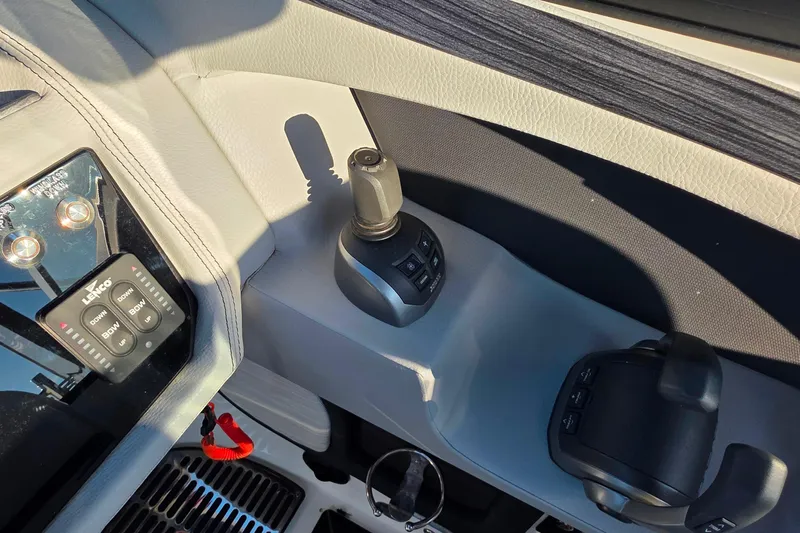  Yacht Photos Pics 2023 Cobalt R30 boat control panel with joystick and Lenco trim tab switches.