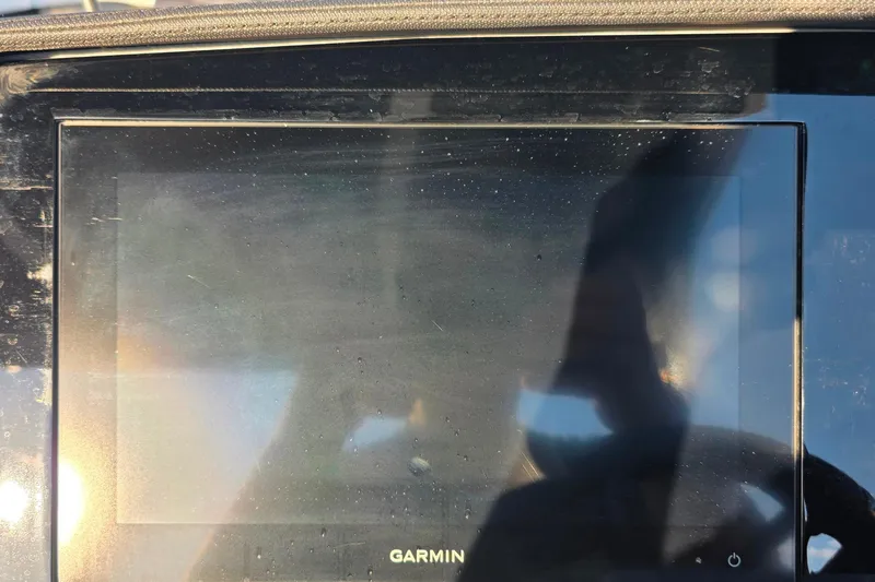  Yacht Photos Pics 2023 Cobalt R30 Garmin display screen with reflections and sunlight glare.