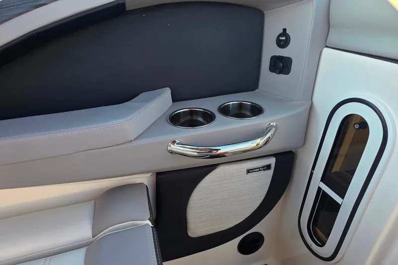  Yacht Photos Pics 2023 Cobalt R30 boat interior with cup holders and Harman Kardon speaker.
