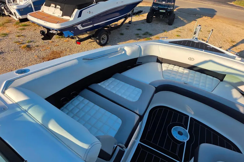  Yacht Photos Pics 2023 Cobalt R30 boat interior with white cushioned seating and sleek design.