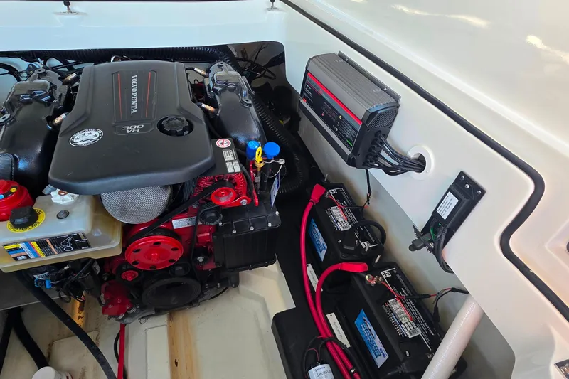 Yacht Photos Pics 2023 Cobalt R30 engine compartment with Volvo Penta engine and battery setup.