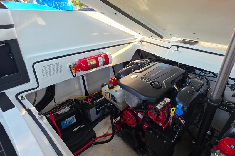  Yacht Photos Pics 2023 Cobalt R30 engine compartment with fire extinguisher and battery setup.