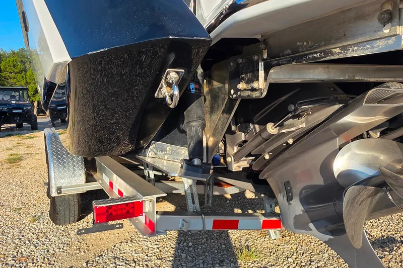  Yacht Photos Pics 2023 Cobalt R30 boat on trailer, showing propeller and rear details.