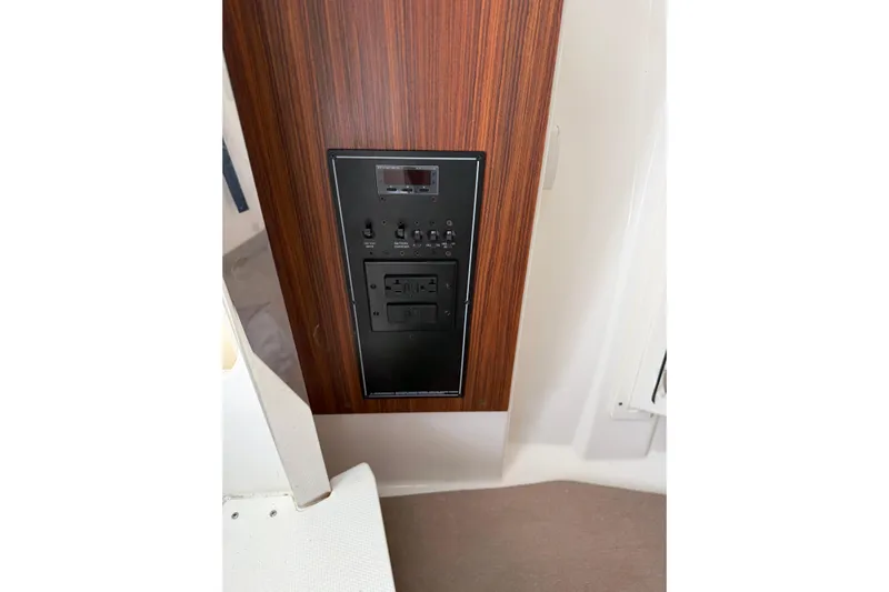  Yacht Photos Pics Control panel on 2023 Pursuit DC 295 Dual Console boat interior.