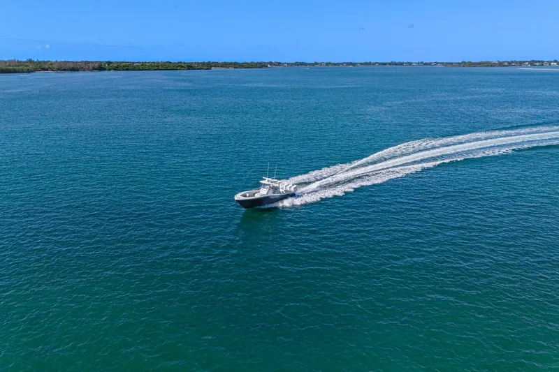 New Stock Yacht Photos Pics 2026 Yellowfin 36 Offshore boat cruising on open blue water.