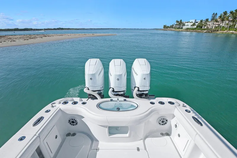 New Stock Yacht Photos Pics 2026 Yellowfin 36 Offshore boat with triple engines on calm water.