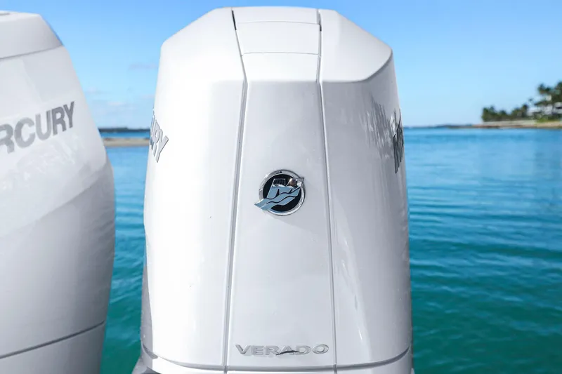 New Stock Yacht Photos Pics 2026 Yellowfin 36 Offshore boat with Mercury Verado engines on clear blue water.