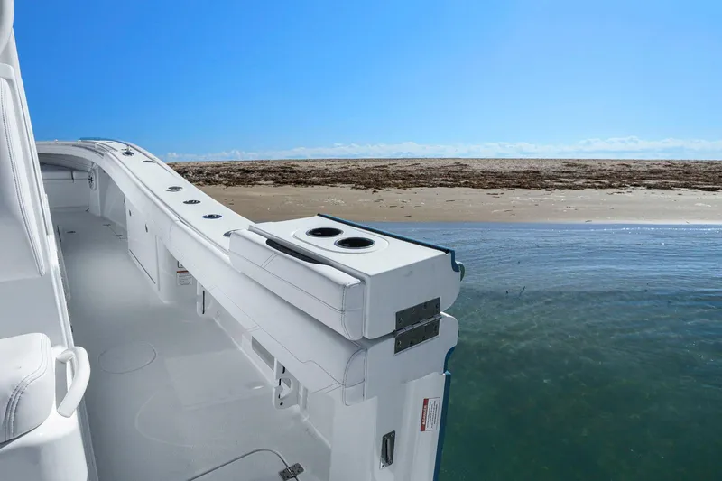 New Stock Yacht Photos Pics 2026 Yellowfin 36 Offshore boat interior with ocean and beach view.