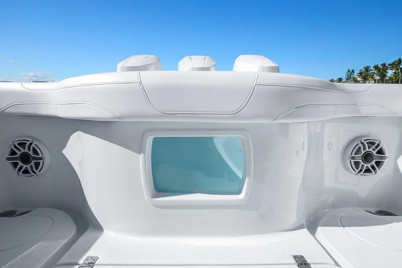 New Stock Yacht Photos Pics 2026 Yellowfin 36 Offshore boat interior with speakers and seating under clear blue sky.