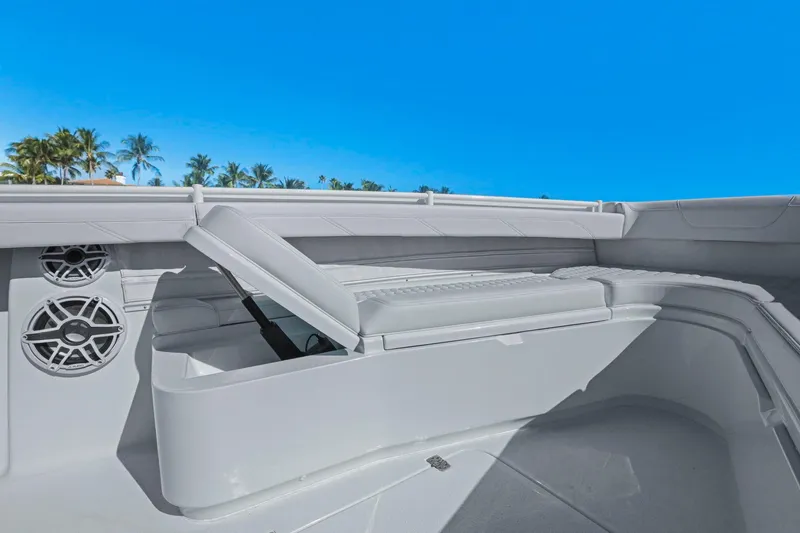 New Stock Yacht Photos Pics 2026 Yellowfin 36 Offshore boat interior with storage and speakers, under clear blue sky.