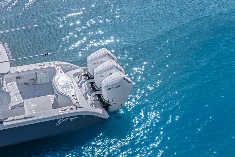 New Stock Yacht Photos Pics 2026 Yellowfin 36 Offshore boat with triple Mercury engines on sparkling blue water.