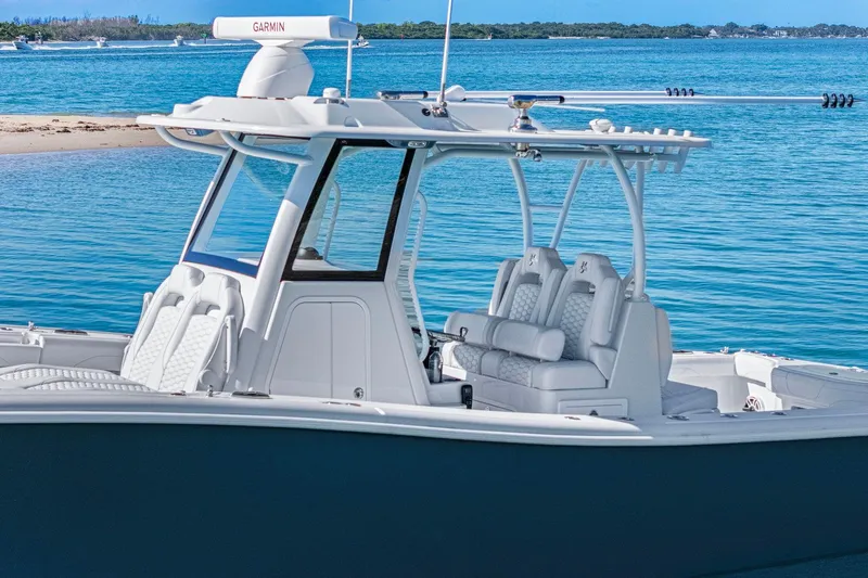New Stock Yacht Photos Pics 2026 Yellowfin 36 Offshore boat on serene blue water, featuring sleek design and modern amenities.