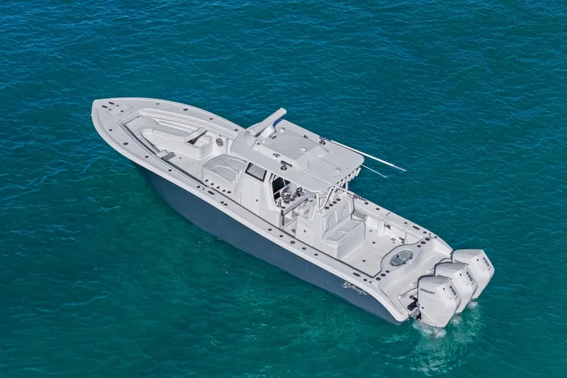 New Stock Yacht Photos Pics 2026 Yellowfin 36 Offshore boat on clear blue water, aerial view.