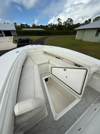 Drillin'n Billin Yacht Photos Pics 2017 Regulator 28 boat with open storage and seating area.