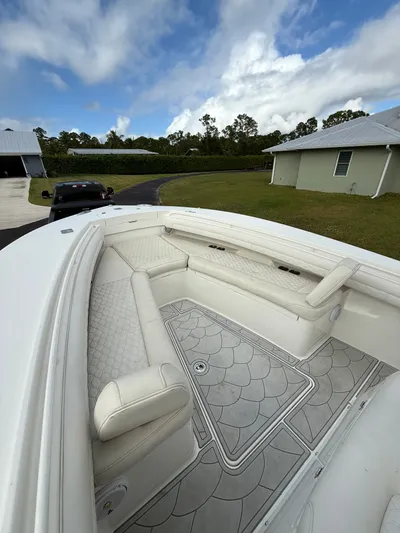 Drillin'n Billin Yacht Photos Pics 2017 Regulator 28 boat with luxurious interior and seating area.