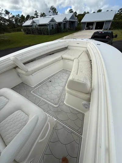 Drillin'n Billin Yacht Photos Pics Interior view of a 2017 Regulator 28 boat with white upholstery.