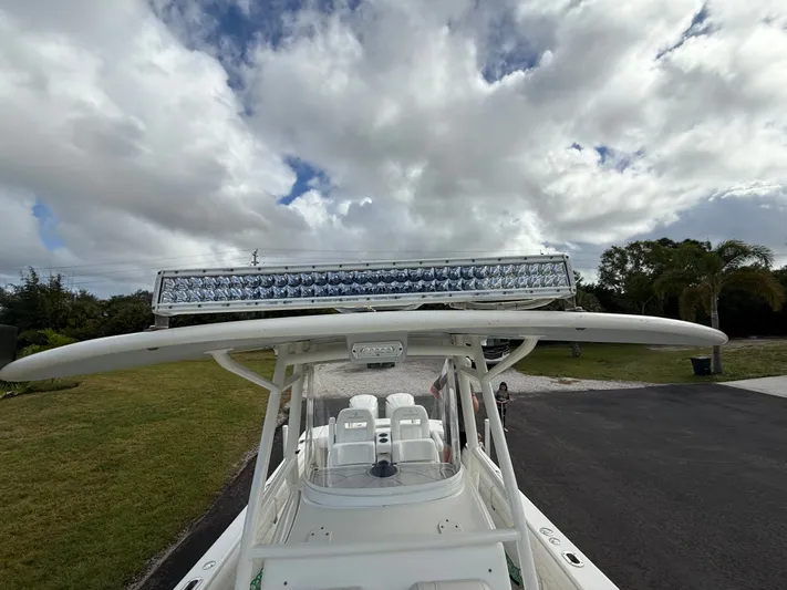 Drillin'n Billin Yacht Photos Pics 2017 Regulator 28 boat with LED light bar under cloudy sky.