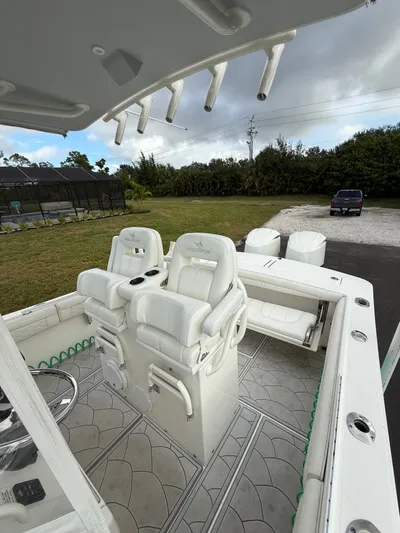 Drillin'n Billin Yacht Photos Pics Interior view of a 2017 Regulator 28 boat with white seating.