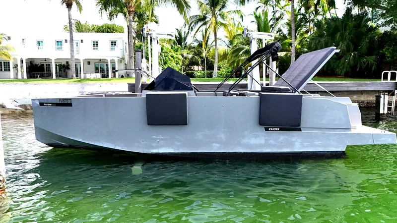  Yacht Photos Pics 2022 De Antonio Yachts D28 Open in a tropical marina setting.