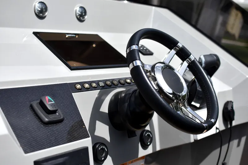  Yacht Photos Pics Steering wheel and controls of 2022 De Antonio Yachts D28 Open boat.