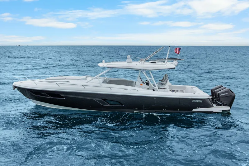  Yacht Photos Pics 2024 Intrepid 41 Valor boat cruising on open sea under clear blue sky.