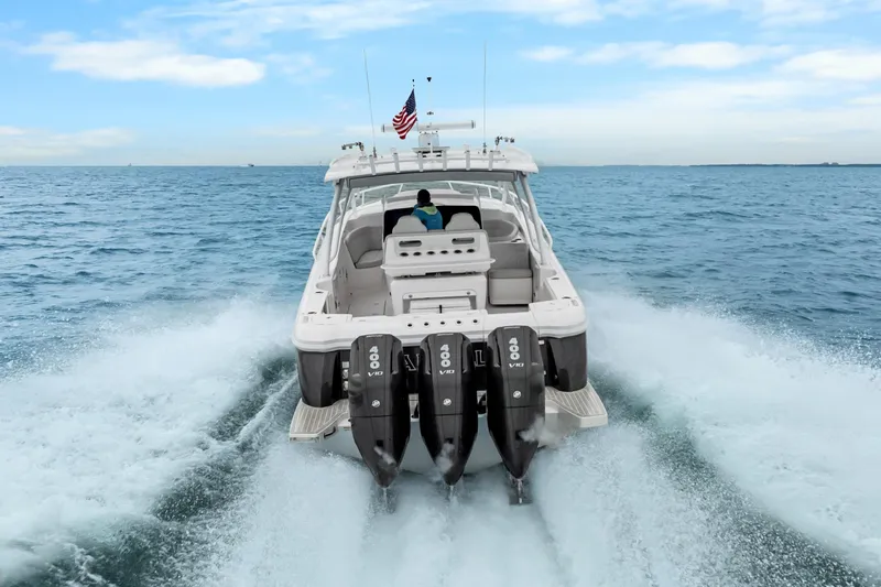  Yacht Photos Pics 2024 Intrepid 41 Valor boat cruising on open water with powerful engines.