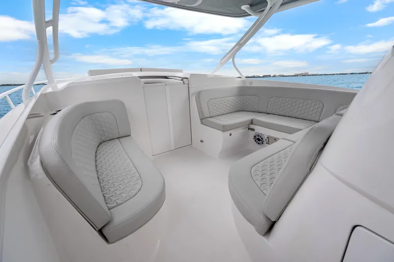  Yacht Photos Pics 2024 Intrepid 41 Valor boat interior with luxurious seating and ocean view.