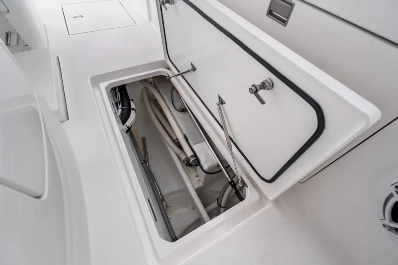  Yacht Photos Pics 2024 Intrepid 41 Valor boat storage compartment with open hatch and visible interior components.