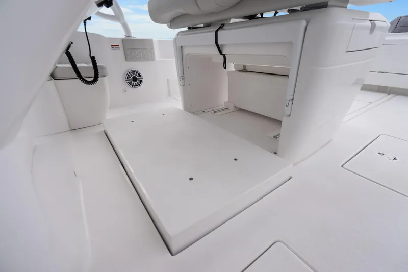  Yacht Photos Pics 2024 Intrepid 41 Valor boat interior with storage compartments and seating area.