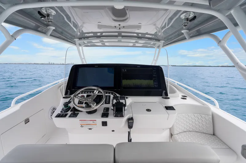  Yacht Photos Pics 2024 Intrepid 41 Valor helm with advanced navigation system on open water.