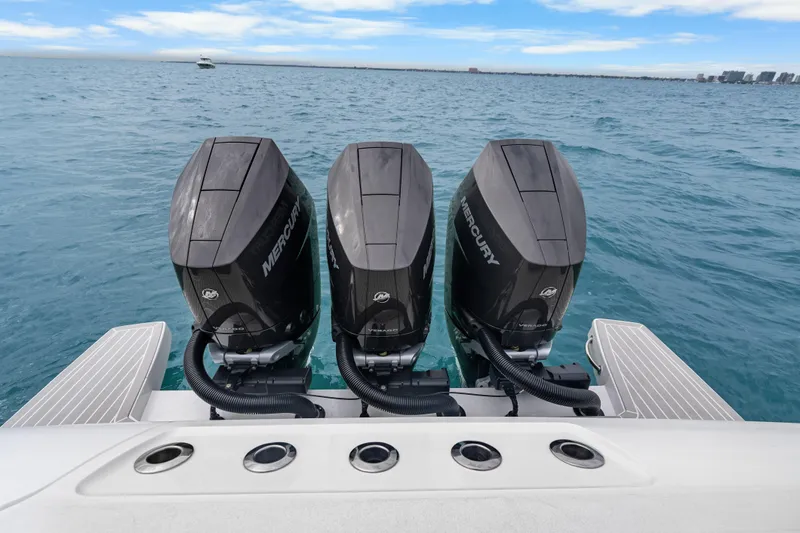  Yacht Photos Pics Triple Mercury outboard engines on a 2024 Intrepid 41 Valor boat in open water.