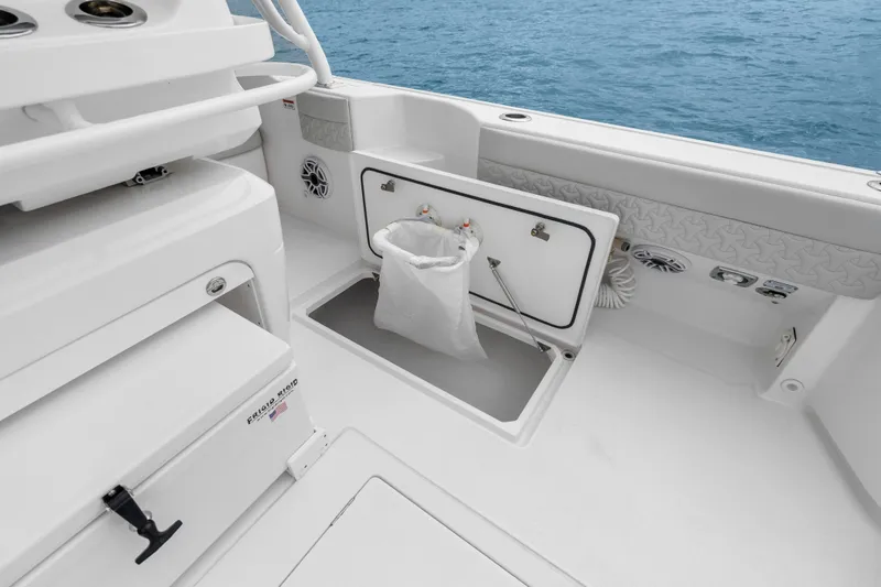  Yacht Photos Pics 2024 Intrepid 41 Valor boat interior with storage compartment and ocean view.