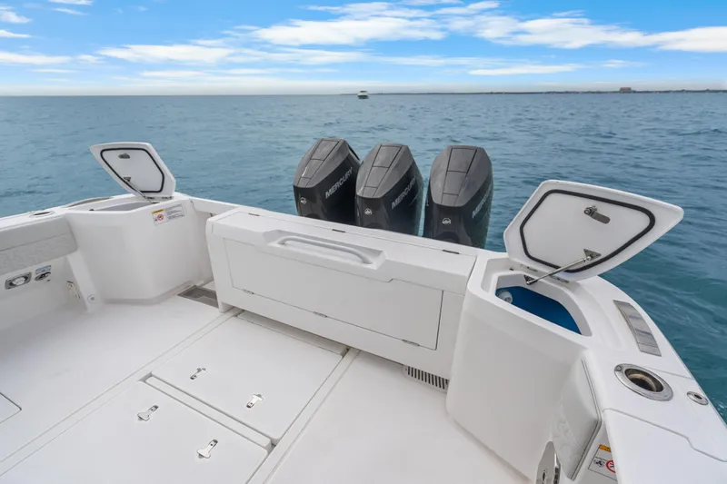  Yacht Photos Pics 2024 Intrepid 41 Valor boat with open storage compartments and powerful Mercury engines.