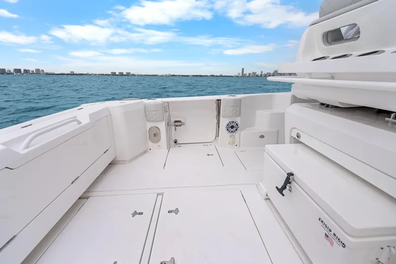  Yacht Photos Pics 2024 Intrepid 41 Valor boat deck with ocean view and city skyline.