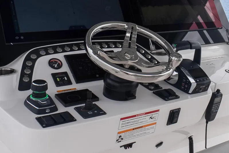  Yacht Photos Pics 2024 Intrepid 41 Valor helm with advanced controls and navigation system.