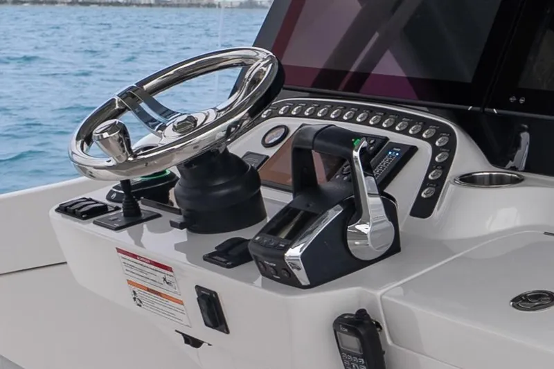  Yacht Photos Pics 2024 Intrepid 41 Valor helm with modern controls and steering wheel.