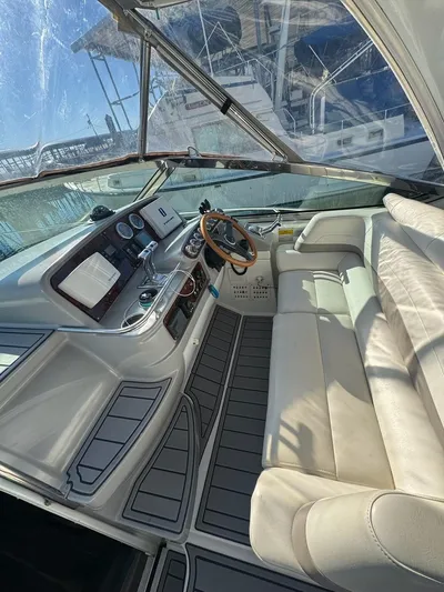 Cash Is King Yacht Photos Pics Interior of a 2002 Formula 40 PC yacht with leather seating and modern dashboard.