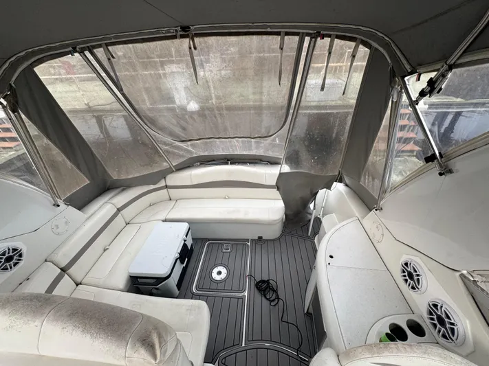 Cash Is King Yacht Photos Pics Interior of a 2002 Formula 40 PC boat with white seating and a cooler.