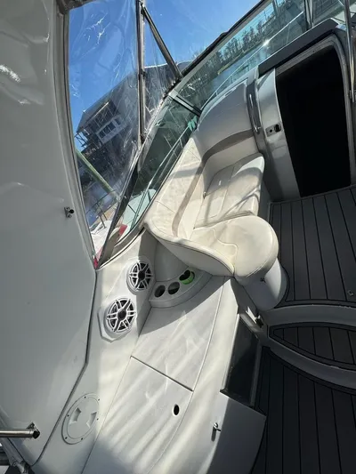 Cash Is King Yacht Photos Pics Interior of a 2002 Formula 40 PC yacht with white seating and speakers.