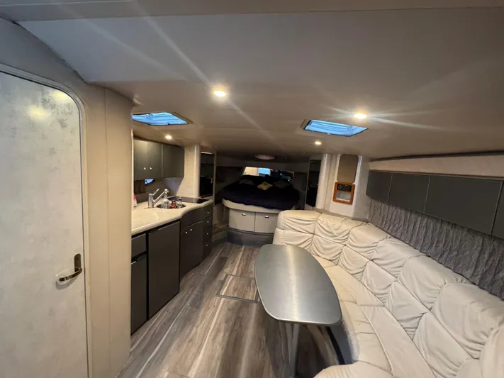 Cash Is King Yacht Photos Pics Interior of a 2002 Formula 40 PC yacht with modern kitchen and seating area.