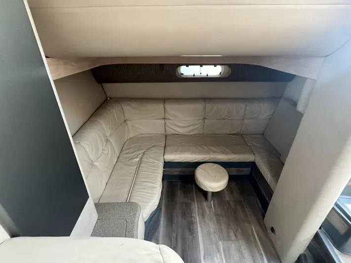 Cash Is King Yacht Photos Pics Interior of 2002 Formula 40 PC yacht with beige leather seating and wood flooring.