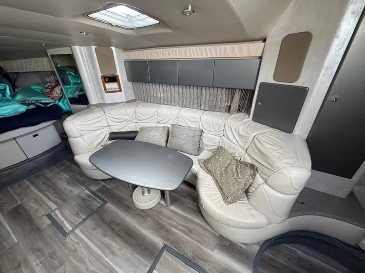 Cash Is King Yacht Photos Pics Interior of 2002 Formula 40 PC yacht with white leather seating and modern decor.
