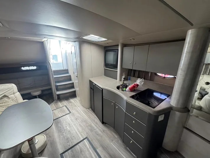 Cash Is King Yacht Photos Pics Interior of a 2002 Formula 40 PC yacht with modern kitchen and seating area.