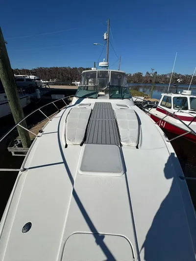 Cash Is King Yacht Photos Pics 2002 Formula 40 PC yacht docked at marina under clear blue sky.
