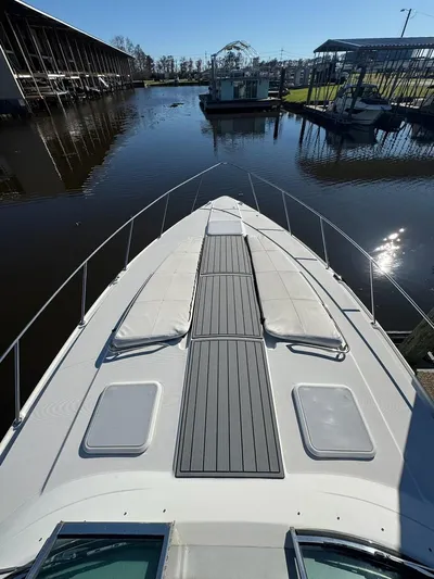 Cash Is King Yacht Photos Pics 2002 Formula 40 PC boat docked in a marina, view from the bow.