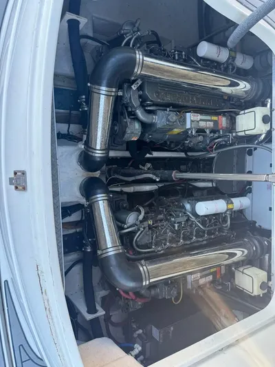 Cash Is King Yacht Photos Pics Engine compartment of a 2002 Formula 40 PC boat, showcasing dual engines and components.