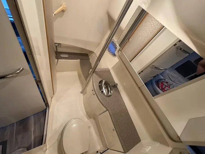 Cash Is King Yacht Photos Pics Bathroom interior of a 2002 Formula 40 PC boat, featuring a sink and toilet.